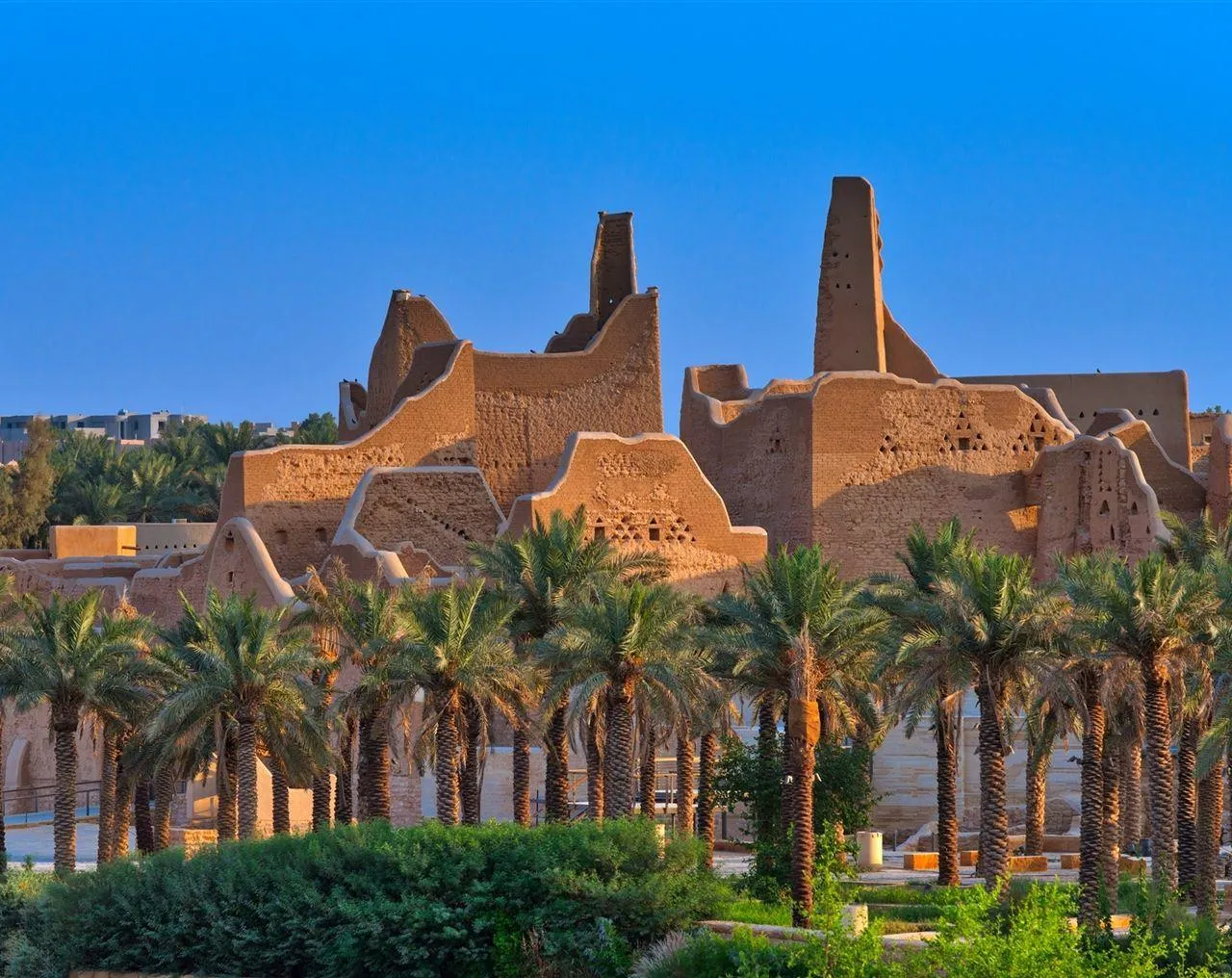 Palm trees framing Diriyah heritage district Riyadh