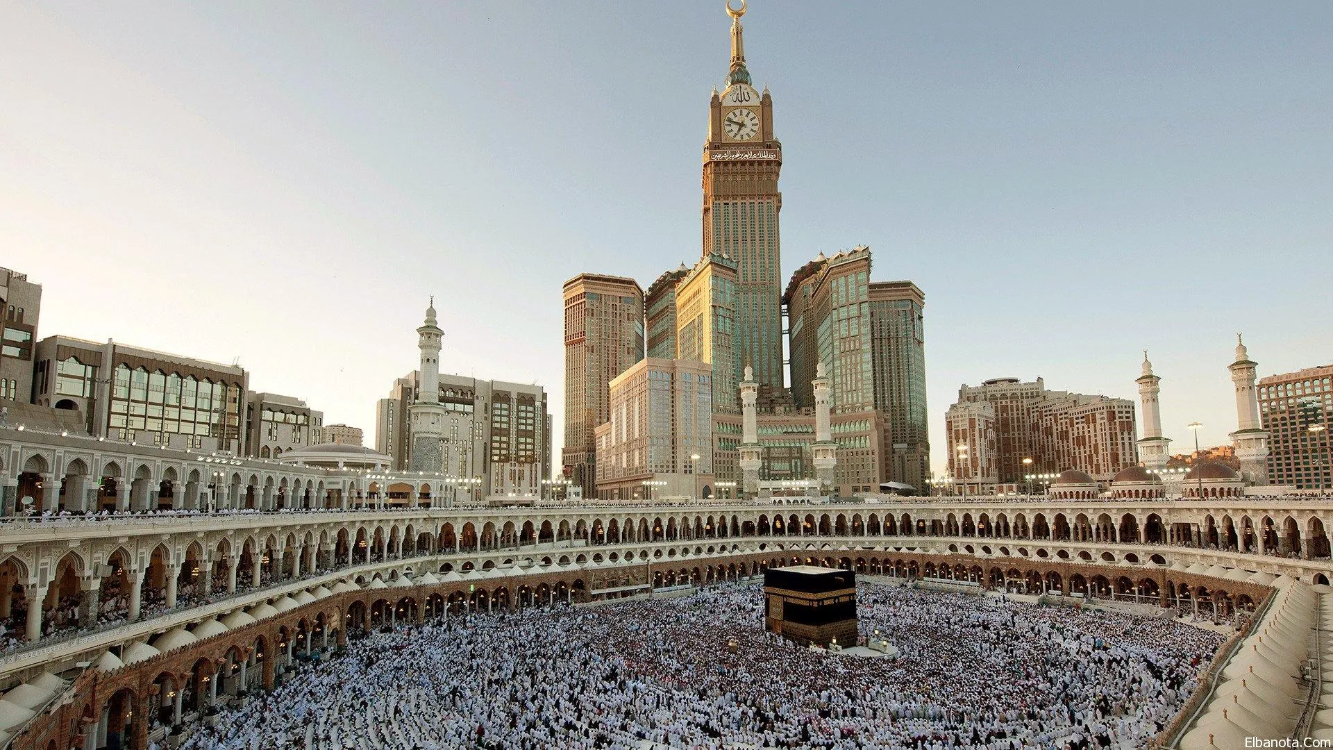 Pilgrims at Kaaba and Makkah Clock Tower panorama