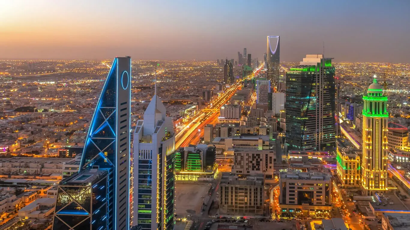 Highway traffic on King Fahd Road Riyadh night skyline