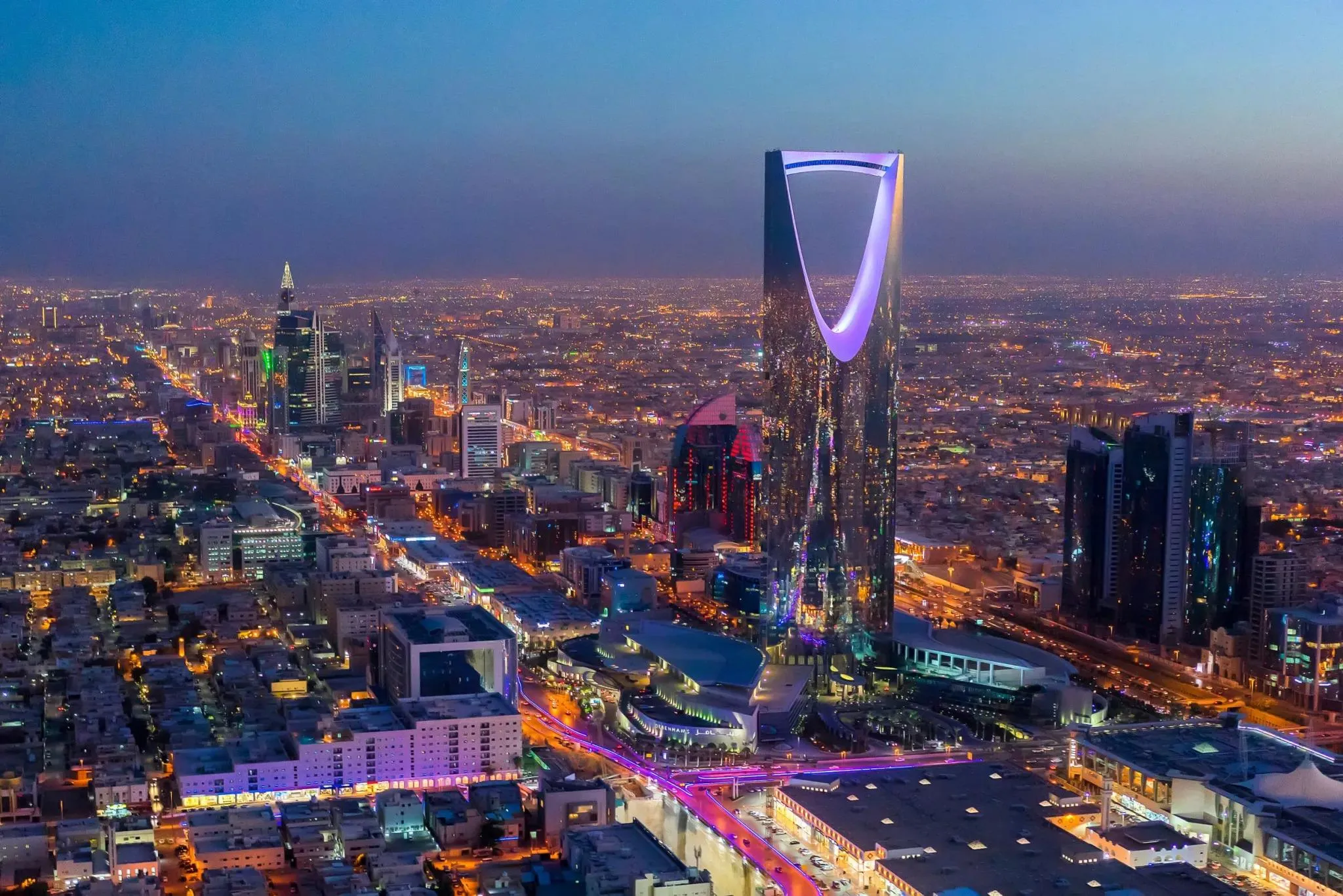 Kingdom Tower Riyadh night skyline glowing in purple