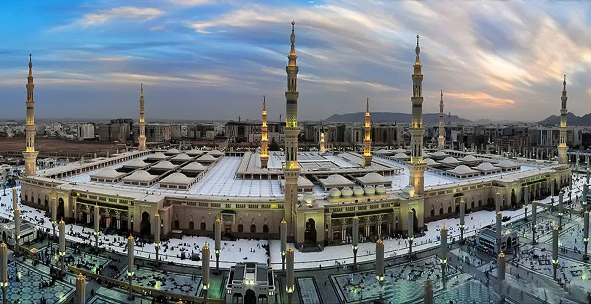 Prophet Mosque Madinah illuminated complex evening view