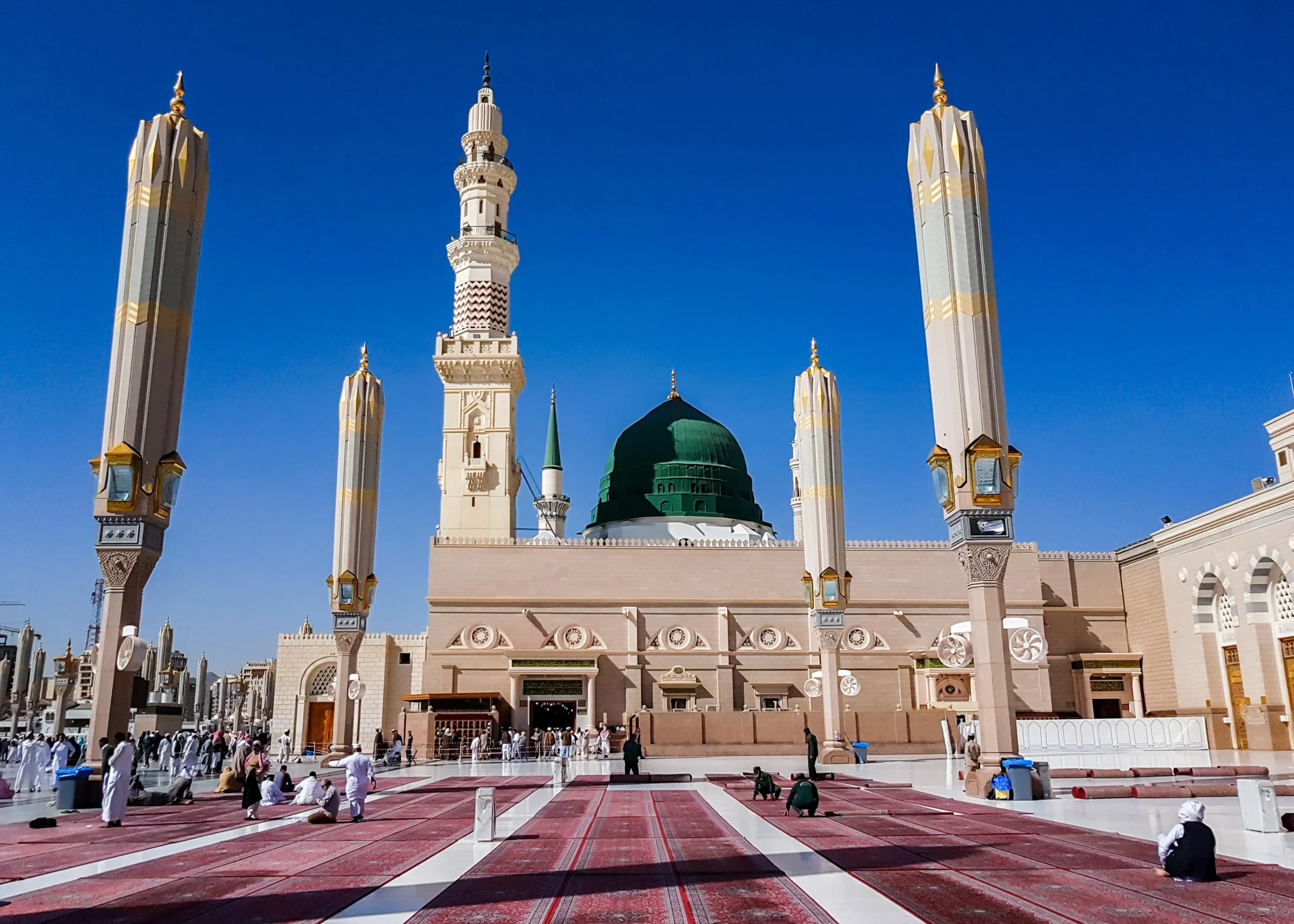 Sunlit courtyard and Prophet Mosque umbrellas Madinah