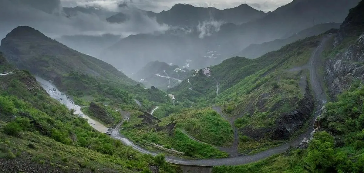 Green hills along misty mountain road in Abha